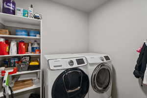 Laundry area featuring washer and clothes dryer