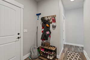 Entryway with hardwood / wood-style flooring