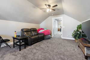 Interior space featuring ceiling fan and vaulted ceiling