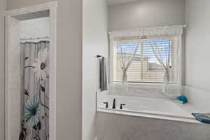 Bathroom with tiled bath