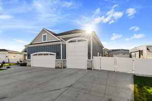 View of front facade featuring a garage