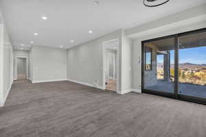 Lower level living room with a mountain view and tile wood-style flooring