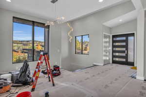 Interior space featuring a notable chandelier and plenty of natural light