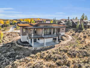 Back of house featuring a deck and patio area