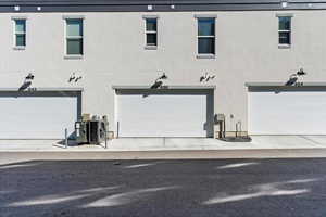 Rear view of house featuring a double garage