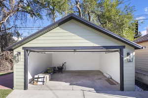 Garage with new roof, siding, and 240 amp panel for EV cars