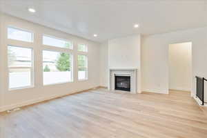 Unfurnished living room with light hardwood / wood-style flooring