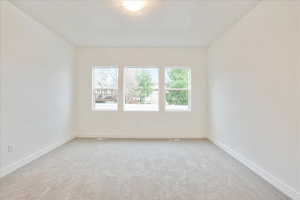 Empty room with carpet floors