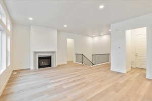 Unfurnished living room featuring light hardwood / wood-style floors