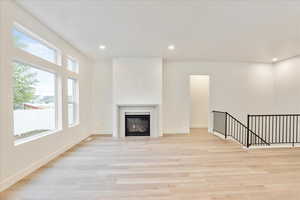 Unfurnished living room featuring light hardwood / wood-style floors