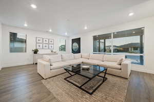 Living room with wood-type flooring