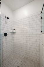 Bathroom with tiled shower