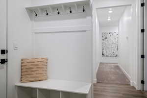 Mudroom with wood-type flooring