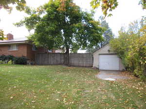 View of yard with a garage