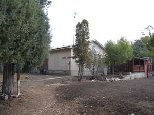 Rear view of house featuring central AC unit