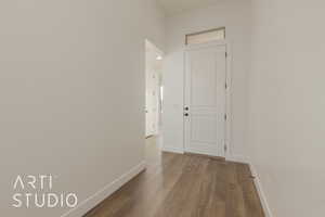 Corridor featuring dark hardwood / wood-style floors