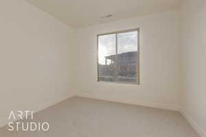 View of carpeted spare room