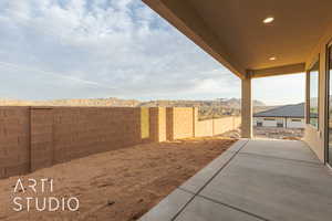 View of yard featuring a mountain view and a patio area