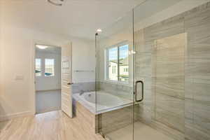 Bathroom with shower with separate bathtub