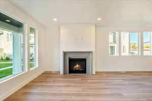 Unfurnished living room with light hardwood / wood-style flooring