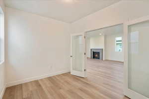 Unfurnished room featuring light wood-type flooring