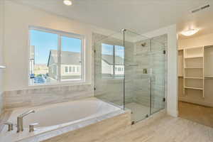 Bathroom featuring plus walk in shower