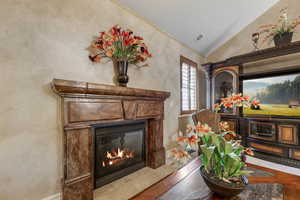 Living room featuring vaulted ceiling