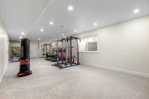 Workout area with light colored carpet