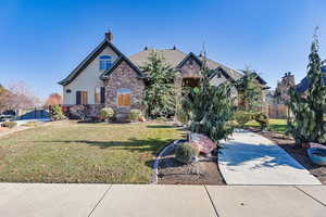 View of front of property with a front yard