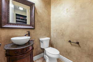 Bathroom with tile patterned floors, vanity, and toilet