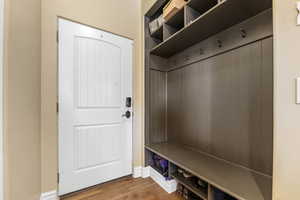 Mudroom with hardwood / wood-style flooring