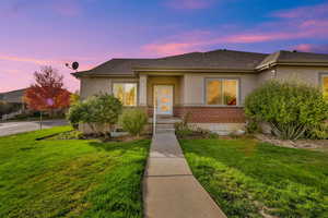 View of front of property featuring a lawn