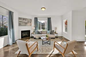 Living room with dark wood-type flooring