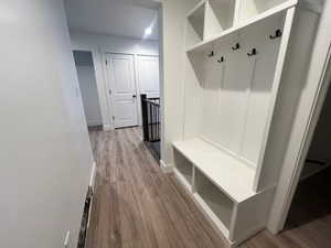 Mudroom with wood-type flooring