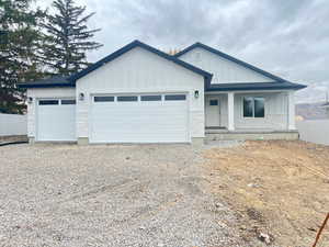 View of front facade featuring a garage