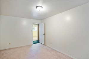 Spare room featuring a textured ceiling