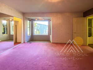 Unfurnished bedroom featuring a closet and carpet flooring