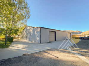 View of outbuilding with a mountain view