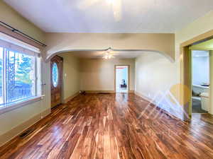 Entrance foyer featuring  hardwood floors and ceiling fan