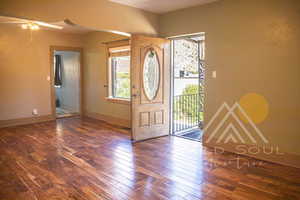 Entryway/Great Room with wood flooring and ceiling fan