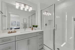 Primary suite bathroom with walk in shower