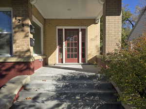 Property entrance with covered porch