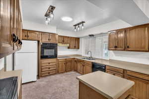 Kitchen featuring sink and black appliances