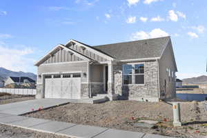 Craftsman-style house with a mountain view and a garage