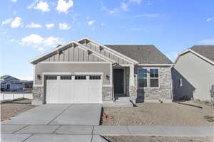 Craftsman inspired home featuring a garage