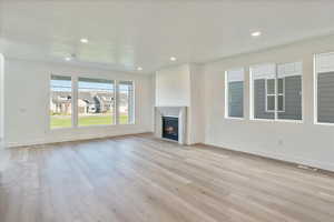 Unfurnished living room with light hardwood / wood-style floors