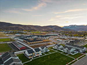 Aerial view at dusk featuring a mountain view