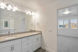 Bathroom featuring vanity and a textured ceiling