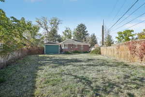 View of yard featuring a shed