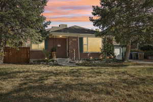 View of front of property with a lawn